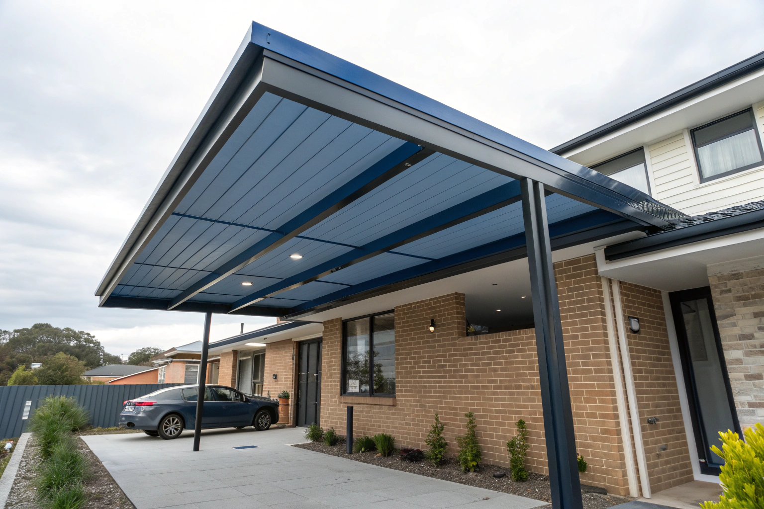 sleek modern carport with deep blue Colorbond steel